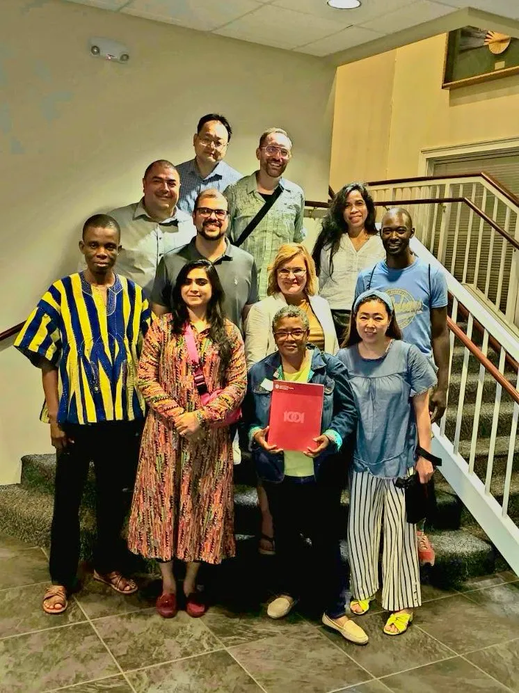 A diverse group of immigrant and intercultural leaders gathered together